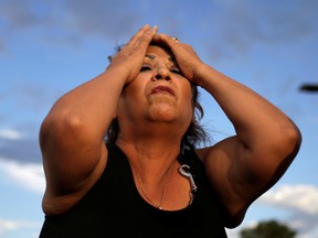 A woman reacts after a mass shooting at a Walmart in El Paso, Texas, U.S. August 3, 2019.