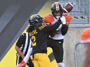 Hamilton Tiger-Cats defensive back Tunde Adeleke, left, knocks the ball away from B.C. Lions receiver Lemar Durant during the first half of their game in Hamilton on Saturday, August 10, 2019. Photo: Jon Blacker.CP