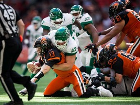 B.C. quarterback Mike Reilly, being sacked by Saskatchewan Roughriders' Zack Evans, will need a lot more protection if the Lions hope to rally in the second half of the CFL season.