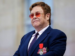 Elton John addresses a crowd in the courtyard of the Elysee Palace in Paris, on June 21, 2019, as part of a ceremony in which he was awarded the French Legion of Honour from the French president and concerts to mark France's annual "Fete de la Musique" (Music Festival). LEWIS JOLY/AFP/Getty Images
