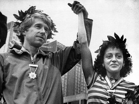 Jacqueline Gareau has her hand held high by Bill Rogers three weeks and two days after the Boston Marathon on April 21, 1980. Garneau was celebrated as first place woman after Rosie Ruiz was disqualified. Rogers was the winner of the men's division.