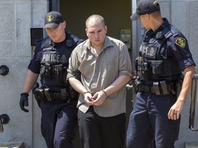 Confined by handcuffs and leg shackles, Corey Vollard is escorted by OPP officers from the Huron County Courthouse to an offender transport van after receiving a ten year sentence for the manslaughter of his fiance Laura Wiglesworth. Derek Ruttan/The London Free Press