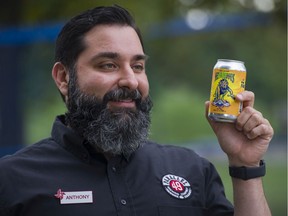 Anthony Frustagli, owner of Parallel 49 Brewery with a can of NeFAIRious, a beer brewed for this years PNE. Photo: Gerry Kahrmann/Postmedia