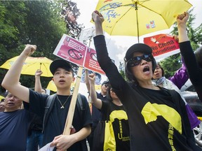 Several hundred people protested at the Consulate General of of the People's Republic of China in Vancouver in June.