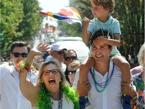 Canadian Prime Minister Justin Trudeau with son, Hadrian and Elizabeth May marches in the 2019 Vancouver Pride Parade in Vancouver,  BC., August 4, 2019.