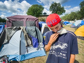 Hector Bravo with his pet mouse Stuart Little at Oppenheimer Park on Aug. 19.