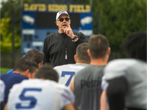 UBC football coach Blake Nill talks to his players at Thunderbird Stadium. The team plays its final home game of the season this Saturday against the UofS Huskies.