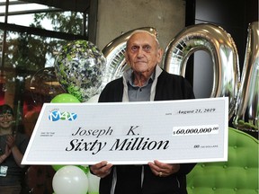 Winner Joseph Katalinic receives his record-breaking $60-million Lotto Max jackpot from the July 26, 2019 draw.