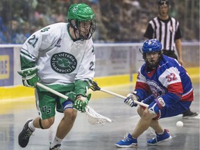 Casey Jackson of the Victoria Shamrocks grabs a loose ball in front of Maple Ridge Burrards Zack Porter during WLA Final action at The Q Centre in Victoria on Aug. 21, 2018.