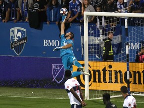 Vancouver Whitecaps goalkeeper Maxime Crepeau (16) makes a save against Montreal Impact during the second half at Stade Saputo on Wednesday.