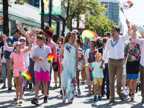 PM Justin Trudeau, right, has made a number of stops in B.C. this summer, usually to wave the Liberal flag and "to make it rain." To quote columnist Mike Smyth: "Trudeau’s government has made 59 separate B.C. spending announcements (or re-announcements in some cases) with an astonishing total price tag of $2.1 billion. That’s about $37 million a day."