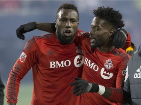 Toronto FC forward Jozy Altidore and Tosaint Ricketts, right, celebrate a 2016 victory over NYFC during MLS playoff action. Ricketts joined the Whitecaps this week.