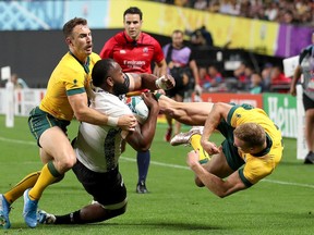 Peceli Yato of Fiji suffered a head injury in this collision with Reece Hodge (right) and Nicholas White of Australia during the Rugby World Cup 2019 Group D game between Australia and Fiji at Sapporo Dome on September 21, 2019 in Sapporo, Hokkaido, Japan.