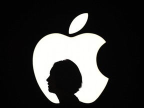 A reporter walks by an Apple logo during a media event in San Francisco, California. - Apple sent out invitations on August 29, 2019 to a September 10 event at its Silicon Valley campus.