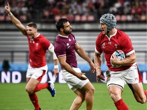 Wales' centre Jonathan Davies scores a try during the Japan 2019 Rugby World Cup Pool D match between Wales and Georgia at the City of Toyota Stadium in Toyota City on September 23, 2019.