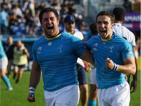 Uruguay's Facundo Gattas and Felipe Etcheverry  celebrate after winning the Japan 2019 Rugby World Cup Pool D match between Fiji and Uruguay at the Kamaishi Recovery Memorial Stadium in Kamaishi on September 25, 2019.
