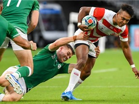 Japan's wing Kotaro Matsushima (R) is tackled by Ireland's wing Jacob Stockdale during the Japan 2019 Rugby World Cup Pool A match between Japan and Ireland at the Shizuoka Stadium Ecopa in Shizuoka on September 28, 2019.