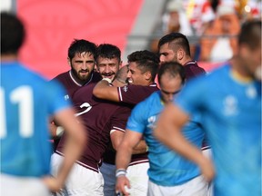 Georgia's hooker Jaba Bregvadze celebrates with teammates after scoring a try during the Japan 2019 Rugby World Cup Pool D match between Georgia and Uruguay at the Kumagaya Rugby Stadium in Kumagaya on September 29, 2019.
