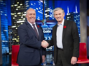 B.C. Premier John Horgan and Liberal Leader Andrew Wilkinson shake hands after a TV debate during the 2018 provincial election campaign.