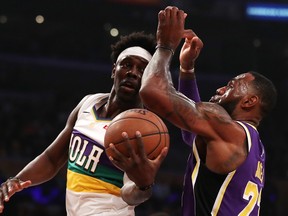 Jrue Holiday of the New Orleans Pelicans looks for a pass against LeBron James #23 of the Los Angeles Lakers during the first half at Staples Center on February 27, 2019 in Los Angeles, California. (Yong Teck Lim/Getty Images)