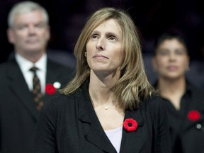 Cammi Granato stands  centre ice after being inducted into the Hockey Hall of Fame in 2010.
