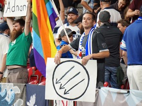 Joshua Griffith and the offending sign which has caused his ban from Vancouver Whitecaps games for the rest of the season.