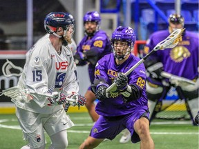 Joe Resetarits of the United States, left, is closely covered by Brayden Hill of the Iroquois Nationals during World Indoor Lacrosse Championship action at Langley Events Centre.
