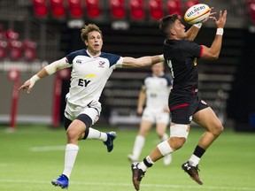 Team Canada  Daniel Tailliferre Hauman (DTH) van der Merwe leaps Team USA  Blaine Scully for the ball in a game at BC Place.