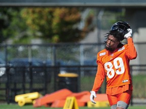 B.C. Lions receiver Duron Carter tears off his helmet at Leos practice in Surrey this week.