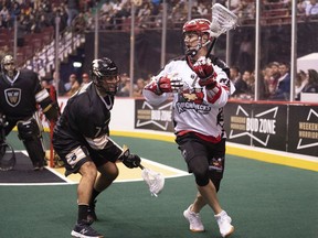 Then-Calgary Roughneck Riley Loewen (right) tries to get past Vancouver Warriors defender Tyler Codron during a Roughnecks-Warriors NLL game last season at Rogers Arena. The two will be teammates this coming season after Loewen signed with the Warriors.