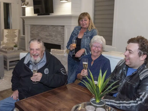 77 year old Albert Prendergast of Port Moody, the winner of the 2019 PNE Prize Home Grand Prize Package celebrates in the Home with his partner, Maureen Newell and daughter-in-law Laurie Newell and grandson Kyle Newell. PNG