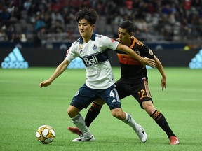 Vancouver Whitecaps midfielder Inbeom Hwang, left, celebrated his 23rd birthday on Friday and have more than 100 guests from the local Korean community watching him play the Columbus Crew Saturday afternoon at B.C. Place Stadium.