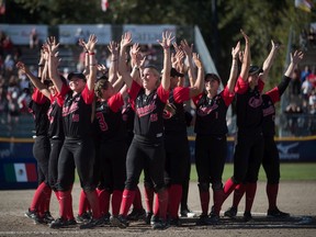 Canada celebrates after defeating Brazil during playoff action at the Softball Americas Olympic Qualifier tournament in Surrey, B.C., on Sunday September 1, 2019. With the win Canada qualifies for the 2020 Tokyo Olympics. Photo: Darryl Dyck/CP