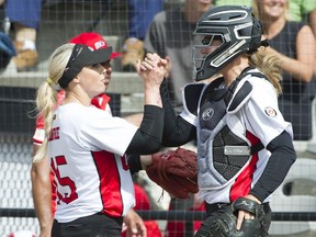 Surrey August 31 2019.  Team Canada #15 Danielle Lawrie and catcher Kaleigh Rafter grabs hands after Lawrie finished pitching an inning against  Team Mexico players in WBSC softball America's qualifier for the 2020 Tokyo games, Softball City, Surrey, August 31 2019.