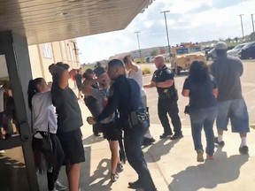 Police clear people fleeing Cinergy Odessa cinema in Odessa, Texas, in this still image taken from a social media video August 31, 2019.