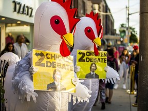 Two people in chicken costumes outside a Liberal Party of Canada fundraiser that the prime minister was attending in Toronto last week.
