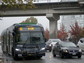 The 96 B-line bus crosses under the SkyTrain tracks outside King George Station on King George Highway in Surrey on Oct. 18.