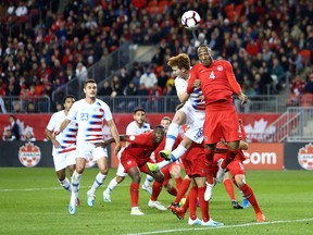 Whitecaps and Canada centreback Derek Cornelius gets his head to the ball in front of USA's Josh Sargent during Tuesday's Nations League game at BMO Field in Toronto.
