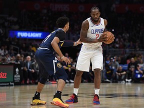 Kawhi Leonard of the L.A. Clippers is defended by Jamal Murray of the Denver Nuggets during a 111-91 Nuggets' pre-season win at Staples Center on Oct. 10 in Los Angeles.