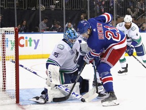 Jacob Markstrom #25 of the Vancouver Canucks makes the second period save on Brett Howden #21 of the New York Rangers at Madison Square Garden on October 20, 2019 in New York City.