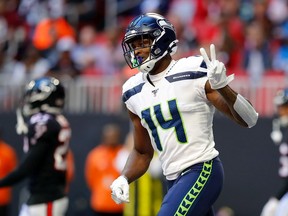 Seattle Seahawks wide receiver D.K. Metcalf reacts after catching a touchdown pass against the Atlanta Falcons during the first half of their Oct. 27, 2019 NFL game at Mercedes-Benz Stadium in Atlanta, Ga.