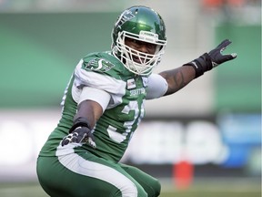 Saskatchewan Roughriders defensive lineman Charleston Hughes celebrates knocking the ball loose from B.C. Lions quarterback Mike Reilly in first half on July 20 at Mosaic Stadium in Regina.