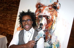 Yared Nigussu’s live art performance and painting of a grizzly bear would garner one of the night’s top bids. Photo: Fred Lee.
