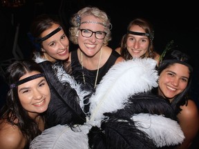 FEATHERED FRIENDS: Vancouver Fraser Port Authority staffers Karina Lukianenko, Maria Anzola, Gillian Behnke, Dianne Sparrow and Emily Sudermann welcomed guests to their Roaring 20s Speakeasy Soiree. Photo: Fred Lee.