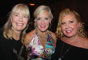 Committee member Barb Estey welcomed Brenda Ouimet and Lori-Ann Keenan to the fundraising dinner and auction. Proceeds from the gala dinner will provide supportive cancer care for people with cancer and their families. Photo: Fred Lee.