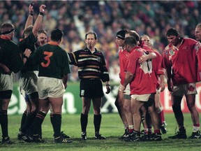 Referee David McHugh holds the two front rows apart during a Rugby World Cup match between Canada and South Africa in Port Elizabeth, 3rd June 1995. South Africa won 20-0.  ORG XMIT: 175309080 [PNG Merlin Archive]
