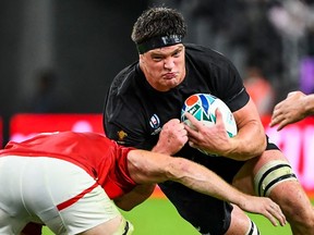 New Zealand lock Scott Barrett is tackled during the Japan 2019 Rugby World Cup Pool B match between New Zealand and Canada at the Oita Stadium in Oita on October 2, 2019.