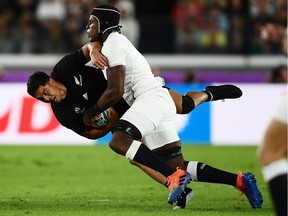New Zealand's centre Anton Lienert-Brown (L) is tackled by England's lock Maro Itoje during the Japan 2019 Rugby World Cup semi-final match between England and New Zealand at the International Stadium Yokohama in Yokohama on Oct. 26, 2019.