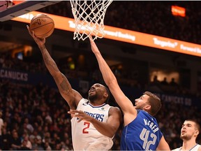 Los Angeles Clippers forward Kawhi Leonard (2) shoots the ball against Dallas Mavericks forward Maxi Kleber (42) during the second quarter at Rogers Arena.