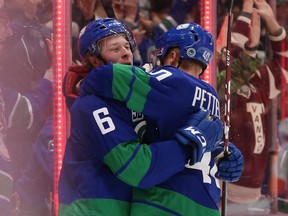 Brock Boeser celebrates his goal with teammate Elias Pettersson during first period NHL hockey action against the Philadelphia Flyers on  Oct. 12, 2019.